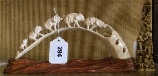 Japanese carved ivory elephant bridge (a.f) & a small okimono carved with figures climbing a tree(2)